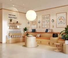 the interior of a store with shelves and plants