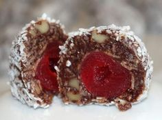 two pieces of chocolate covered with fruit and nuts