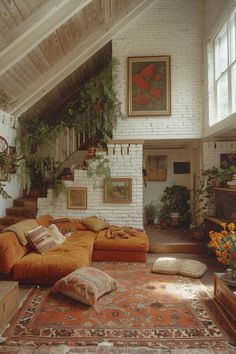 a living room filled with lots of furniture and plants