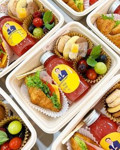 six plastic containers filled with different types of food and condiments on top of each other