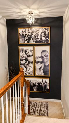 there is a stairway with pictures on the wall