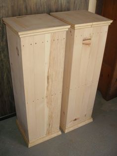 two unfinished wooden cabinets sitting next to each other