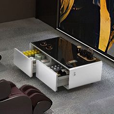 a modern coffee table with two drawers on the bottom and one drawer open in front