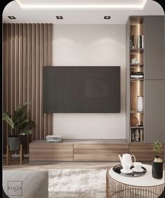 a living room with a large television on the wall next to a coffee table and bookshelf