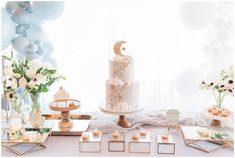 a table topped with lots of cakes and desserts