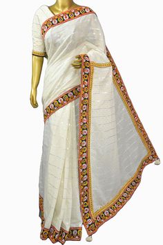 The hand-picked collection from the handloom weavers comes with this silver and golden buti work on the pallu of the chanderi cotton silk saree with a fascinating Kathiawadi-style dignified border with thorough mirror embroidery work to match its appearance. Color: A shade of offwhite color Technique: Comes with all-over traditional zari butta weaving on the pallu with Kathiawadi style border and mirror embroidery work allover. Fabric: Chanderi Cotton Festive White Dola Silk Dupatta, White Bollywood Dupatta With Dori Work, White Traditional Art Silk Dupatta, White Art Silk Dupatta For Festive Occasions, Traditional White Dori Work Wear, Traditional White Wear With Dori Work, Bollywood Style White Dupatta With Dori Work, Festive White Chanderi Dupatta, Festive White Saree With Silk Thread