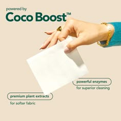 a woman's hand holding a piece of paper with the words cocoboost on it