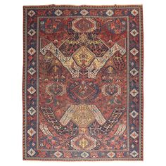 an antique persian rug is shown on a white background