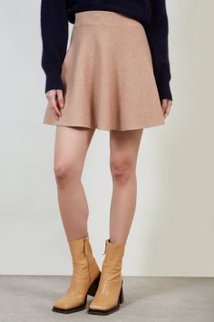 Shop For Beige Shaped Knit Mini Skirt At Glassworks London. Free Uk Shipping For Orders Over £75. Buy Now Pay Later With Klarna. | Fit: True To Size | Care: Gentle Wash Cold And Dry In Shade | Lining: None | Stretch: Low | Thickness: Moderate | Sheerness: None | Materials: 80% Acrylic, 20% Polyester | Measurements: 1. Waist: 30cm, 2. Length: 42cm Winter Stretch Mini Skort, Casual A-line Mini Skirt For Winter, Winter Mini Length Stretch Skort, Stretch Mini Skort For Winter, Chic A-line Winter Mini Skirt, Beige Mini Skirt For Fall, Chic Knit Mini Skirt For Spring, Knit Mini Skirt For Spring, Spring Knit Mini Skirt