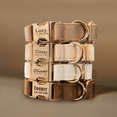 four different types of dog collars stacked on top of each other with gold buckles