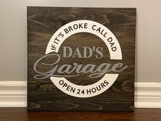 a wooden sign that says it's broke called dad's garage open 24 hours