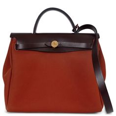 This 100% authentic Hermès Herbag Zip 31 Retourné Verso bag is crafted from Rouge Sellier (Maroon) Vache Hunter leather and Cuivre (dark brick) Toile Officier, accented with a vibrant Orange Mécano (coral) zip pocket on the back. It features elegant gold-plated hardware and a fixed shoulder strap for versatile wear. The bag closes with two straps and a signature Clou de Selle lock on the front. The interior is lined in Orange Mécano canvas and includes a zip pouch on a leather strap for additional organization. This stunning Hermès bag perfectly blends bold color and classic craftsmanship. Has been carried and is in excellent condition with minimal wear to the bottom corners and a long the bottom edge of the back pocket. Comes with full set. Measurements Model H082268CCAP Height 26cm (10.1 Jane Birkin, Zip Pouch, Vibrant Orange, Hermes Bag, Hermes Birkin, Bago, Fashion Handbags, Switzerland, Bags Handbags