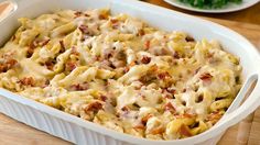 a casserole dish filled with pasta and meat