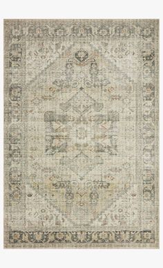 an antique rug with grey and beige colors