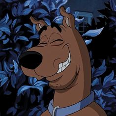 a cartoon dog with his eyes closed and mouth wide open in front of some bushes