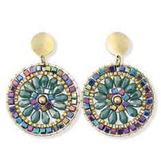 a pair of earrings with colorful beads and gold disc shaped earring hooks on top of each other