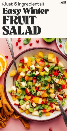 a bowl filled with fruit salad on top of a table