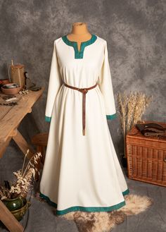 The dress has simple medieval cut with long sleeves, loose and comfortable. The historical pattern - an important element when playing historical realities, especially Vikings or Slavs. Put on your cloak and travel back to the Middle Ages. Hunting, ancient legends, the warmth of the hearth and our dress will give you an unforgettable experience. The simple cut of the dress allows you to move freely, as well as boldly add accessories to the dress. The dress will perfectly fit into the basic wardr Fall Medieval Dress With Long Sleeves, Long Sleeve Medieval Dress With Historical Design For Fall, Fall Medieval Dress With Historical Design, Long Sleeve Medieval Dress For Larp, Peasant Style Medieval Dress With Long Sleeves, Viking Style Long Sleeve Medieval Dress For Festivals, Long Sleeve Medieval Dress With Historical Design For Festivals, Traditional Long Sleeve Dresses For Medieval Festivals, Long Sleeve Dresses For Medieval Festivals