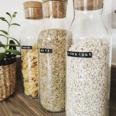 three glass jars filled with different types of food