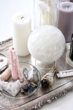 a tray with candles and other items on it