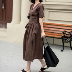 "This elegant linen dress exudes a timeless charm with its deep brown hue and minimalist design. A defining feature is the wrap-around tie at the waist, which accentuates the silhouette and adds a touch of grace. The dress falls to a mid-calf length, offering a flowy and comfortable fit that moves with ease. Ideal for both casual outings and more formal events.  DETAIL * 100% Linen * Two side pockets * Shortsleeve linen dress * Plus size dress * Belted Linen dress * Midi length * Perfect for summer, spring * Casual linen dress, plus size linen dress * Wash by hand or machine with cold water *The model is 170cm (5′ 7″) tall with a 80cm (31.5\") bust, 66cm (26\") waist. She is wearing in size XS * Choose CUSTOM Order if you Need a better fit Can't find your size in our size Chart Change the Brown V-neck Maxi Dress For Work, Brown V-neck Midi Dress For Work, Brown V-neck Solid Color Dress, Brown V-neck Solid Dress, Brown V-neck Dress, Casual Brown Linen Maxi Dress, Chic Brown Linen Dress For Spring, Solid Linen V-neck Maxi Dress, Brown Linen Spring Dress