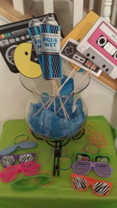 a table topped with lots of assorted items on top of a green table cloth