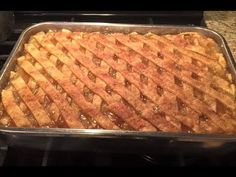 a pan filled with food sitting on top of a stove