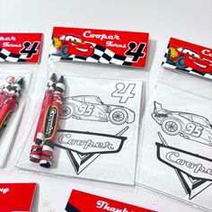 four coloring pages with crayons and markers on top of each one in the shape of a race car