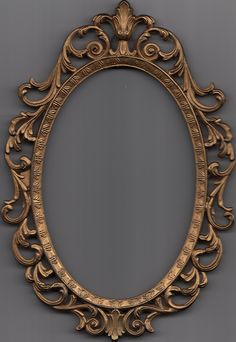 an ornate gold framed mirror on a gray background with clippings to the bottom