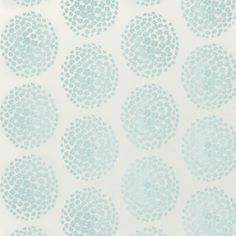 a blue and white wallpaper with circles on it