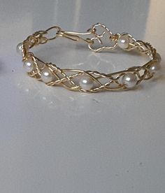 a close up of a bracelet on a table