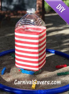 a plastic bottle sitting on top of a blue hula hoop