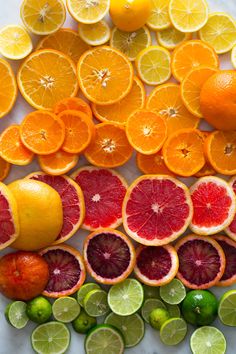 oranges, limes and grapefruit cut in half