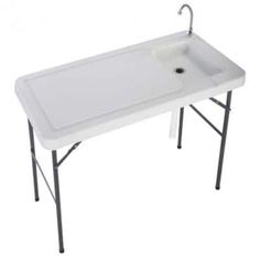 a white sink sitting on top of a table