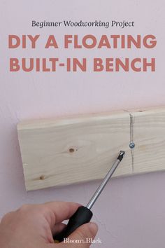 someone is working on a woodworking project with the words diy a floating built - in bench