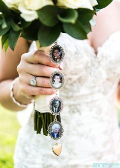 a woman holding a bouquet of flowers with pictures attached to it's wrist and wearing an engagement ring