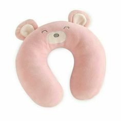 a pink teddy bear shaped pillow on a white background