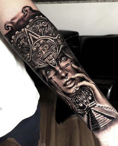 a man's arm with a clock and face tattoo on the left side of his arm