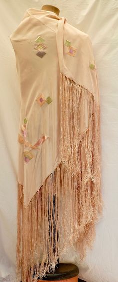 c1920's Art Deco Piano Shawl This is a very Elegant Peach coloured Silk Piano Shawl. The Shawl has a lovely geometric patterns embroidered in Silk on it .  The shawl has a lovely fringe around the edge There are a few water marks on the shawl which could be removed with a good dry cleaning  and can be seen on the photos but it is in very good condition The shawl's measurements are 130cm X 130cm The fringe is 45cm long Nal Hutta, Piano Shawl, Star Wars Planets, Historical Clothes, Peach Colour, Blanket Shawl, Edwardian Dress, Shawl Pattern, Historical Clothing