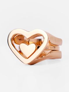 Introducing our first-of-a-kind heart-shaped beauty: the Kiota 3-in-1 Ring. This versatile design features two rings that can be worn together or separately, offering a multi-functional style. A smaller solid ring nestles gracefully inside the larger hollow ring, creating a stunning statement piece. You can effortlessly switch between bold style and everyday wear, wearing it solo or layering for a personalized look. Modern Heart-shaped Wedding Rings, Modern Double Heart Jewelry For Anniversary, Modern Heart Shaped Promise Ring, Modern Heart-shaped Promise Ring, Modern Heart-shaped Rings For Valentine's Day, Rose Gold Promise Ring With Open Heart Shape, Modern Heart-shaped Anniversary Rings, Modern Heart Shaped Anniversary Rings, Elegant Adjustable Open Heart Stackable Rings