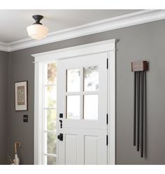 a white door in a gray room