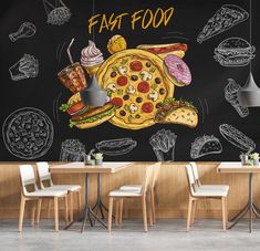 a chalkboard wall with an image of a pizza and other food items on it