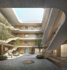 an open courtyard with stairs leading up to the second floor