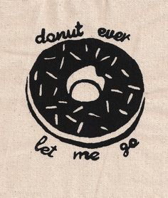 a black donut with sprinkles on it that says, donut ever let me go