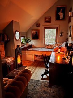 a living room filled with furniture and a fire place next to a window on top of a wooden floor