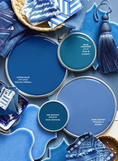 the cover of home magazine with blue paint and accessories on it's table top