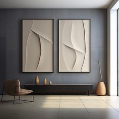 two abstract paintings hang on the wall in a modern living room