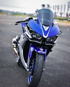 a blue motorcycle is parked on the street