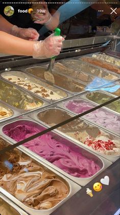 an ice cream shop filled with lots of different types of gelato and desserts