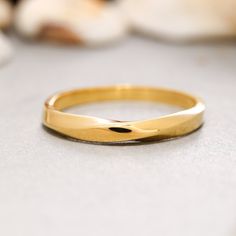 a close up of a gold ring on a table